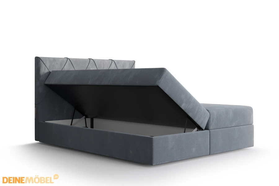 Praktisches Boxspringbett mit geöffnetem Bettkasten bietet viel Stauraum.