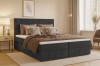 Elegantes Boxspringbett in Anthrazit mit vertikal gestepptem Kopfteil im Schlafzimmer.