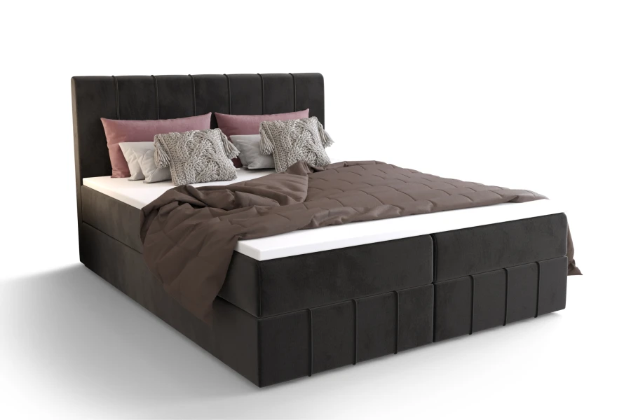 Freigestelltes Boxspringbett in Dunkelgrau mit moderner Längssteppung und Kissen.