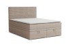 Beige Boxspringbett mit Bettkasten und geripptem Kopfteil, isoliert auf weiß.
