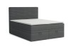 Graues Boxspringbett mit Bettkasten und Kopfteil in Cord-Optik vor weißem Hintergrund.
