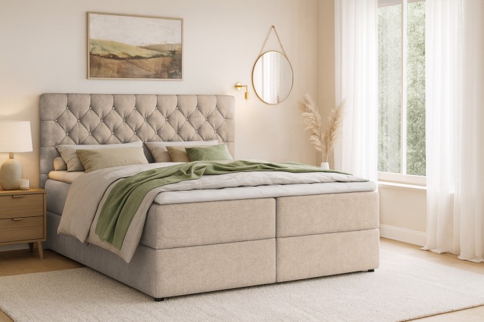 Modern boxspringbed in beige met gecapitonneerd hoofdbord in een gezellige slaapkamer.