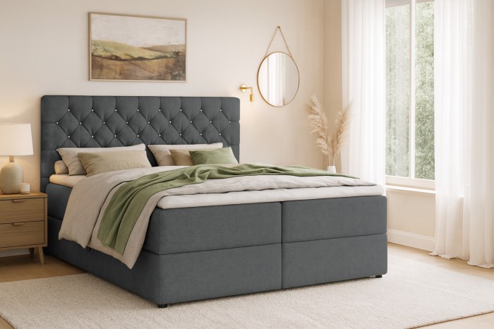 Modern slaapkamerambiance met een donkergrijs boxspringbed.