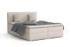 Elegant boxspringbed Bello in crème met decoratieve kussens en grijze sprei vrijstaand.