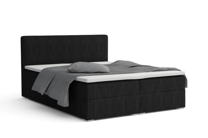 Modern boxspringbed LON IV in zwart met cord-look en grijs kussen op een witte achtergrond.