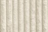Detailaufnahme des beigen Cord-Stoffs für Boxspringbetten.
