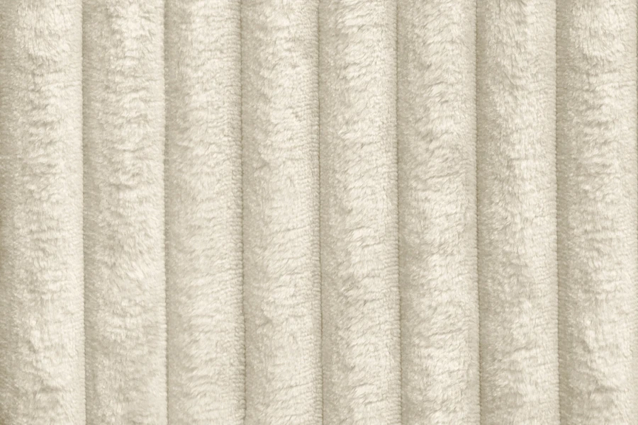 Detailaufnahme des beigen Cord-Stoffs für Boxspringbetten.