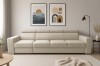 Beiges 3-Sitzer Sofa in modernem Wohnzimmer mit abstrakter Kunst.