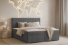 Stilvoll eingerichtetes Schlafzimmer mit Loft IV Boxspringbett in Anthrazit und Deko.