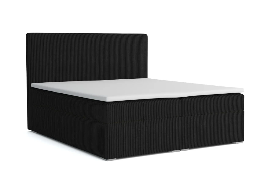 Schwarzes Boxspringbett mit Cord-Bezug und weißem Topper, isoliert auf weiß.