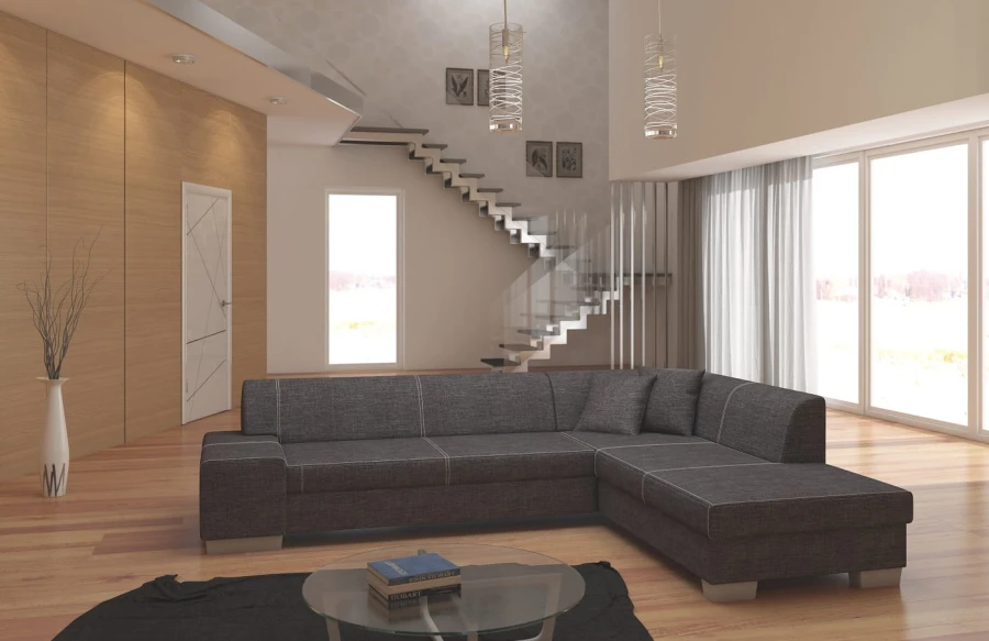 Dunkelgraues Ecksofa in minimalistischem Wohnzimmer mit stilvoller Glastreppe