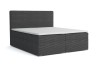 Anthrazitfarbenes Boxspringbett mit weichem Cord-Bezug.