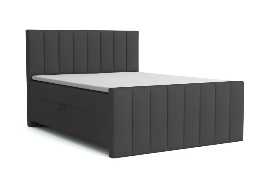 Dunkelgraues Boxspringbett mit elegantem, vertikal gestepptem Design.