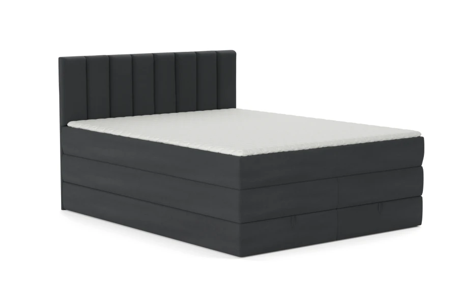 Dunkelgraues Boxspringbett in Anthrazit mit gestepptem Kopfteil und weißer Matratze.