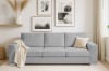 Modernes hellgraues Cord-Sofa im minimalistischen Wohnzimmer mit Wandbildern.