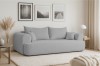 Gemütliches blaugraues Sofa in minimalistischem Wohnraum mit moderner Wanddekoration.