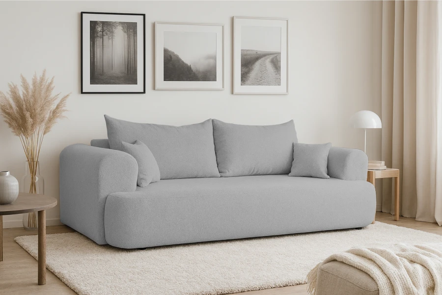 Gemütliches blaugraues Sofa in minimalistischem Wohnraum mit moderner Wanddekoration.