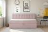Gemütliches rosa Polsterbett mit dekorativer Knopfheftung im hellen Schlafzimmer.