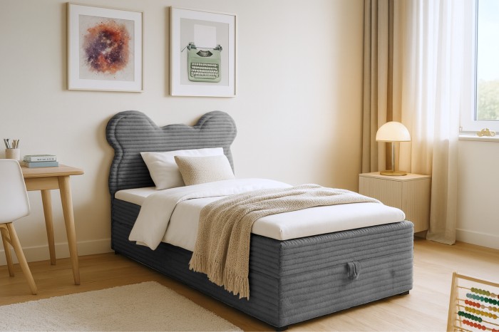 Cosy box spring bed for children in grey with playful bear ears on the headboard.