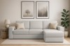 Hellgraues L-Form Sofa im skandinavischen Wohnzimmer mit Deko und Wandbildern.
