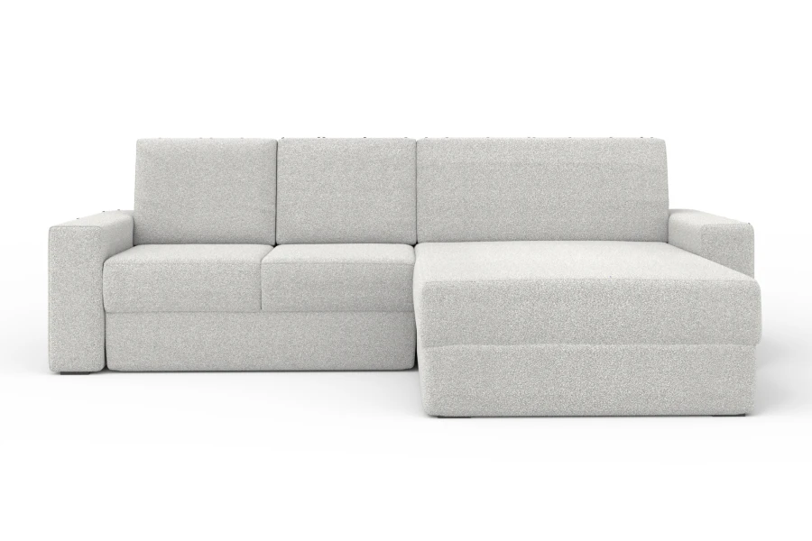 Hellgraues Ecksofa TOCO XL vor weißem Hintergrund mit Ottomane auf der rechten Seite.
