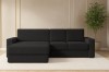 Schwarzes Ecksofa im Wohnzimmer mit Pflanze und Teppich