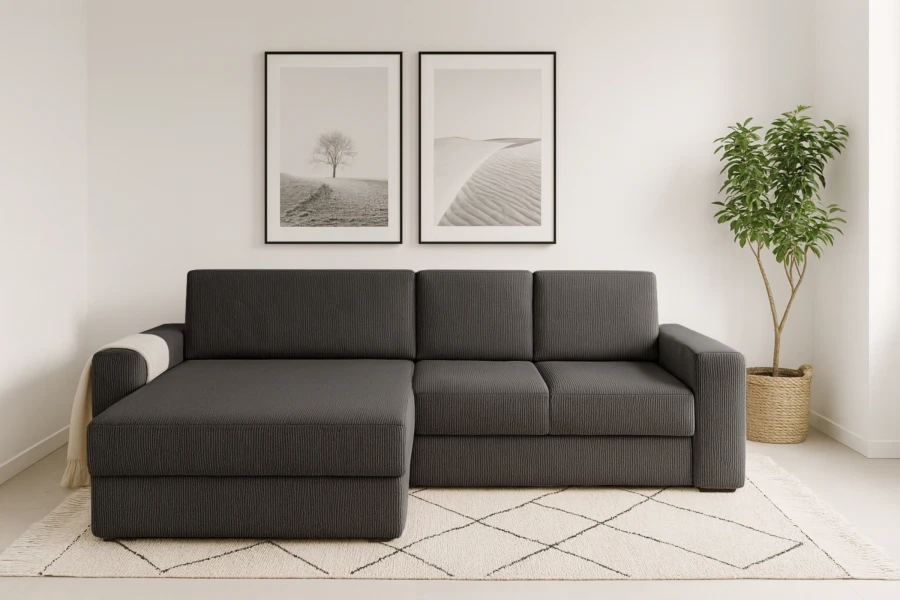 Moderne hoekbank in antraciet met cord-bekleding in een lichte woonkamer.