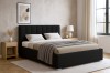 Schwarzes Polsterbett mit modernem Kopfteil in stilvollem Schlafzimmer Interieur.