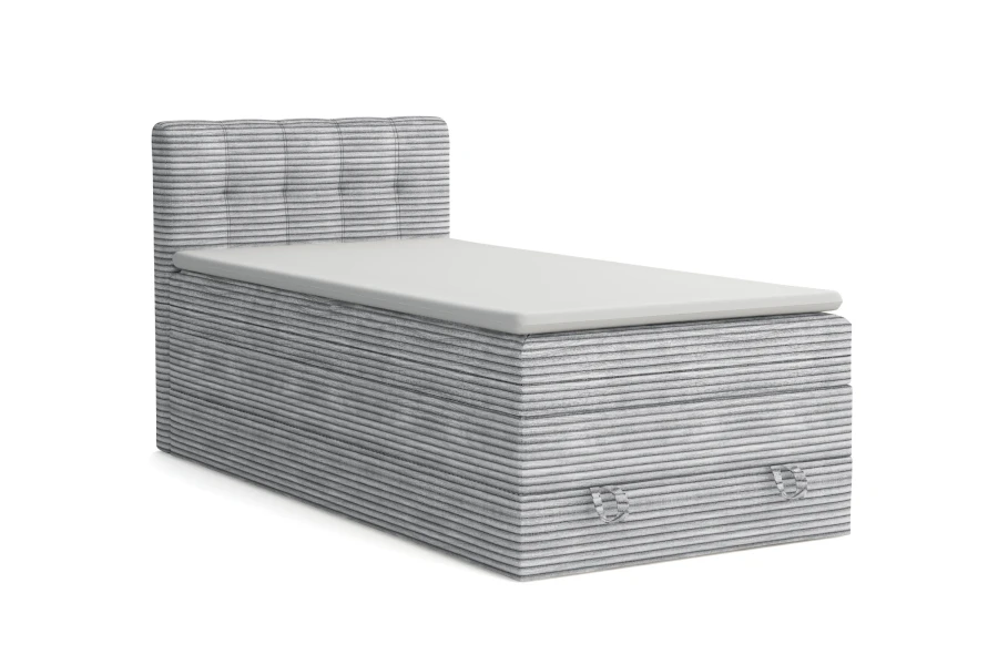 Graues Boxspringbett mit Cord-Bezug freigestellt auf weißem Hintergrund.