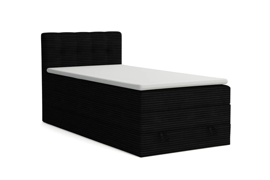 Schwarzes Boxspringbett in Cord-Optik mit weißem Topper, isoliert auf Weiß.
