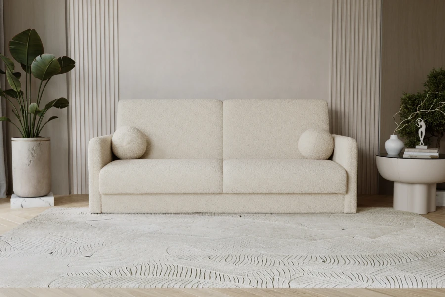 Beiges Bouclé-Sofa in modernem Wohnzimmer mit runden Zierkissen und hellem Teppich.