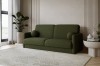 Stilvolles dunkelgrünes Bouclé Sofa in einem modern gestalteten Wohnzimmer.