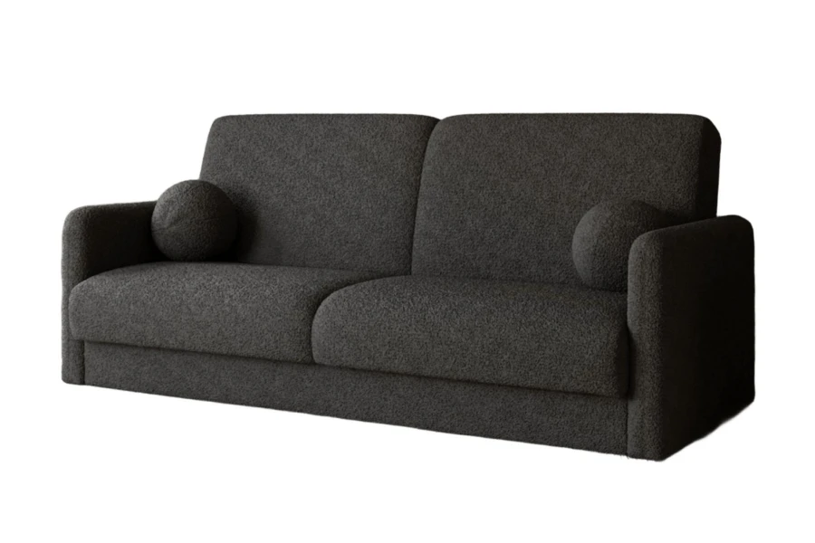 Anthrazitfarbenes Bouclé Sofa mit weichem Stoff und zwei runden Kissen.