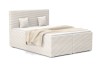 Elegantes Boxspringbett in Creme mit strukturiertem Cordstoff, inklusive Kopfteil und dekorativen Kissen.