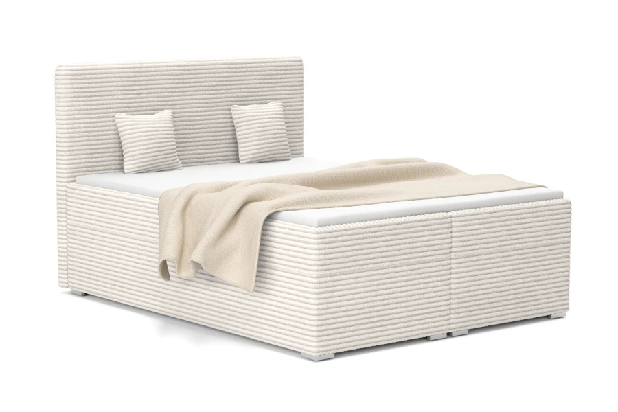 Elegantes Boxspringbett in Creme mit strukturiertem Cordstoff, inklusive Kopfteil und dekorativen Kissen.