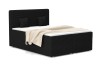 Schwarzes Boxspringbett in Cord-Optik mit beiger Decke auf weißem Hintergrund.
