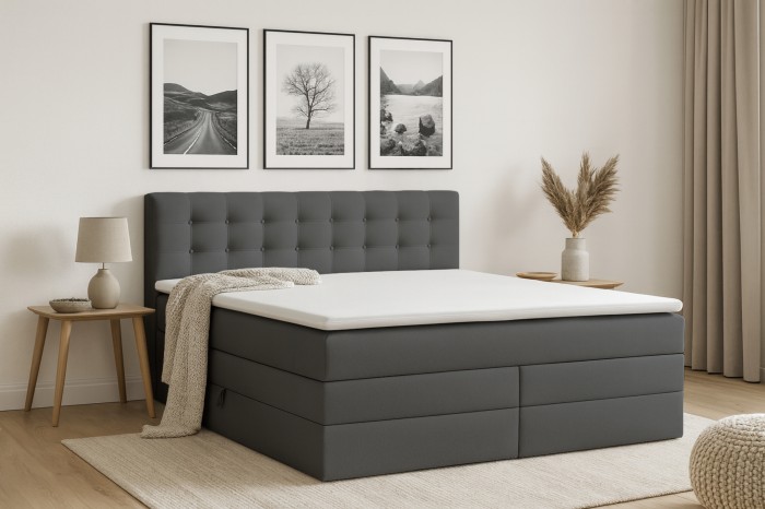 Elegantes dunkelgraues Boxspringbett in gemütlichem Schlafzimmer mit Wandbildern und Holznachttischen.