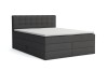 Dunkelgraues Boxspringbett mit weißem Topper und Knopfsteppung am Kopfteil vor weißem Hintergrund.