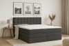 Modernes Boxspringbett in Anthrazit mit Decke im stilvollen Schlafzimmer-Ambiente.
