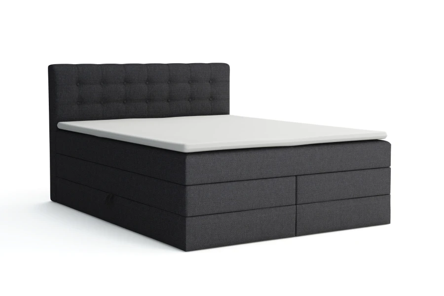 Anthrazitfarbenes Boxspringbett mit gepolstertem Kopfteil und weißem Topper.