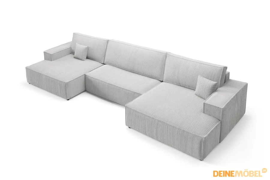 Moderne U-Form Wohnlandschaft aus hellgrauem Cord-Stoff mit Kissen für das Wohnzimmer.