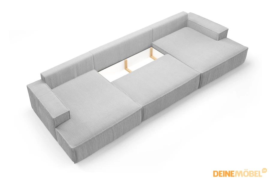 Detailansicht des Bettkastens eines grauen Cordsofas für Stauraum.