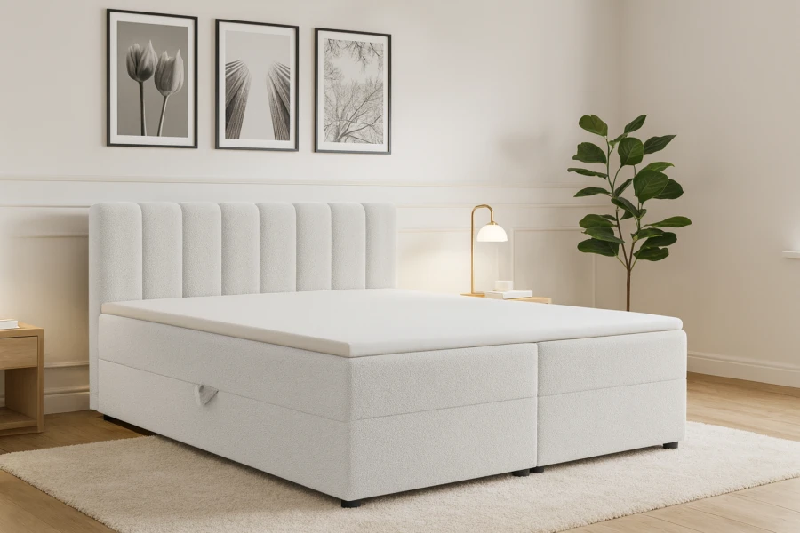 Modernes weißes Boxspringbett Vanessa mit vertikal gestepptem Kopfteil in hellem Schlafzimmer.