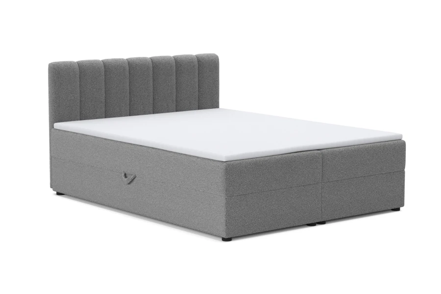 Hellgraues Boxspringbett mit gestepptem Kopfteil und Bettkasten