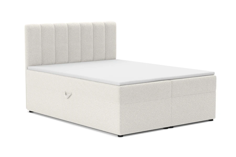 Modernes Vincent Boxspringbett in Weiß mit weichem Bouclé-Bezug.
