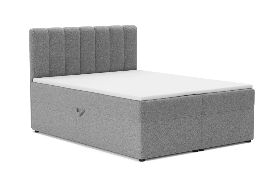 Elegantes Boxspringbett in Grau mit vertikal gestepptem Kopfteil und weißer Matratze.