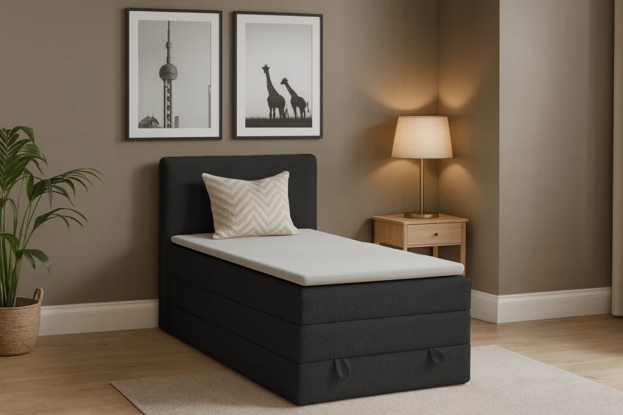 Modernes dunkelgraues Boxspringbett Einzelbett im Schlafzimmer.
