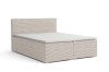 Doppel-Boxspringbett in hellem Cord-Bezug freigestellt.