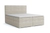 Boxspringbett mit beigem Cord-Stoff, horizontal gerippt, auf weißem Grund.
