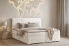 Modern eingerichtetes Schlafzimmer mit Boxspringbett in Cord-Optik und Deko.